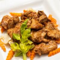 Garlic Pepper Chicken · Chicken marinated in garlic and black pepper, stir-fried with carrot and cabbage. Served wit...