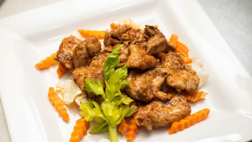 Garlic Pepper Chicken · Chicken marinated in garlic and black pepper, stir-fried with carrot and cabbage. Served with steamed rice.