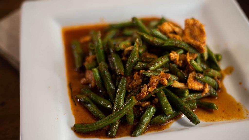 Pad Prik King · Stir-fried green beans with spicy red chili sauce. Served with steamed rice.