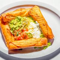Flautas Supreme · Four flour tortillas deep-fried and filled with chicken and cheese. Served with lettuce, pic...