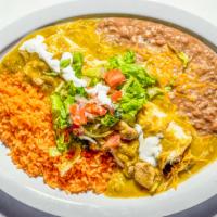 Chili Verde Smothered Burrito · Pork chunks in a tomatillo salsa mixed with pico de gallo and sour cream. Served with rice a...