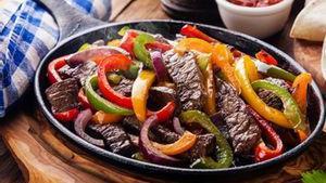 Steak Fajita · All fajitas are cooked with bell pepper, onion, and tomato smothered with cheese. Served wit...