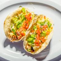 Fish Taco · Taco with cilantro, onion, lime, and salsa.