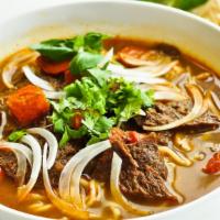Spicy Noodle · Spicy. Famous au Lac traditional soup large rice vermicelli noodles, vegan ham, beef less pr...