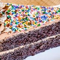 Chocolate Cake · The most popular vegan cake at Loving Hut. Enjoy a luxurious slice of vegan chocolate cake t...