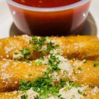 Mozzarella Fritta · Deep-fried mozzarella sticks served with our delicious marinara sauce.
