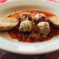 Mario'S Meatballs · Four house made meatballs in marinara sauce topped with melted mozzarella served with toaste...