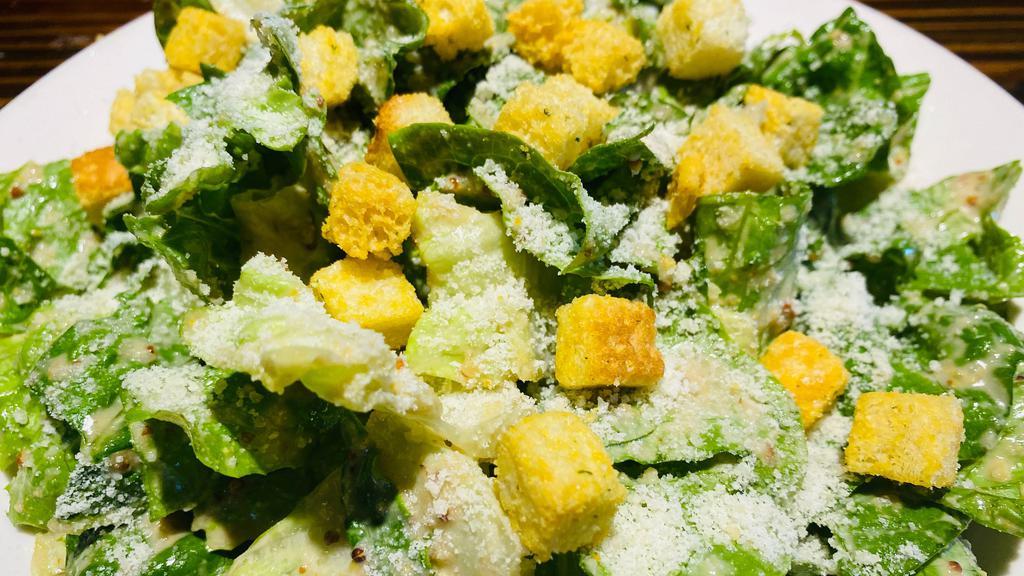 Classic Caesar Salad (Large) · Crisp romaine tossed with our house made dressing parmigiano and seasoned croutons.
