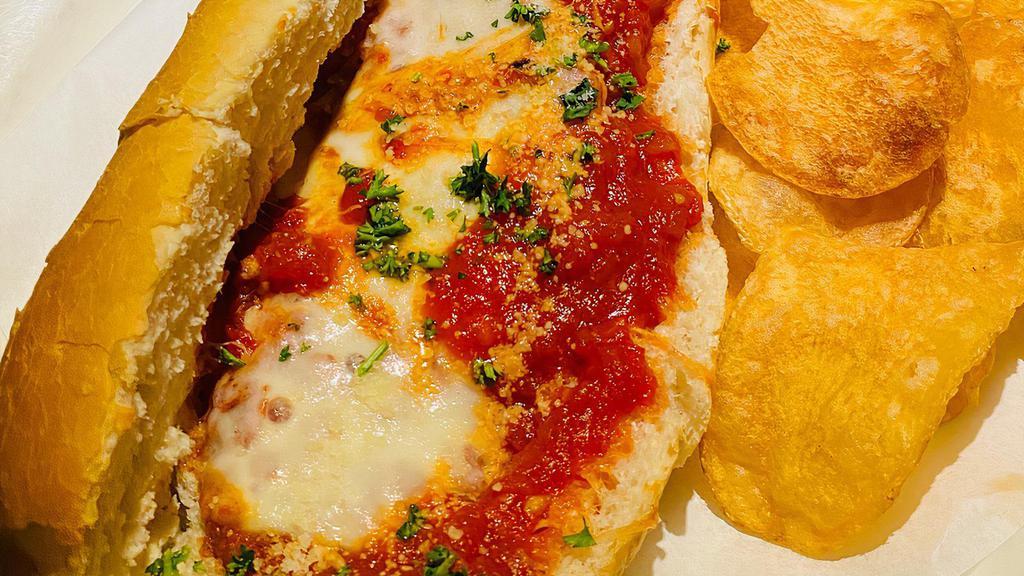 Eggplant Sandwich · Lightly breaded fried eggplant, topped with marinara sauce and melted mozzarella, served on a fresh Italian roll with our house-made chips.