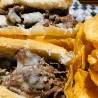 Cheese Steak · Thinly sliced grilled rib-eye steak with melted cheese .Served on a soft Italian roll with o...