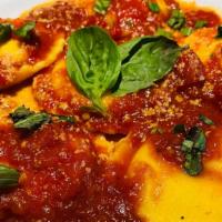Ravioli Di Formaggio · Mario's handmade ravioli filled with ricotta, mascarpone, parmigiano and mozzarella topped w...