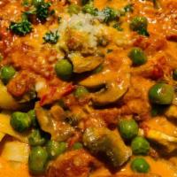 Fettuccine Aurora · House made fettuccine in tomato sauce with peas and mushrooms. Your choice of soup or salad ...