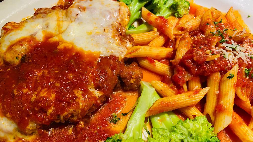 Chicken Parmigiana · Breast of chicken breaded and baked with marinara and mozzarella served with penne marinara and broccoli. Your choice of soup or salad and garlic bread.