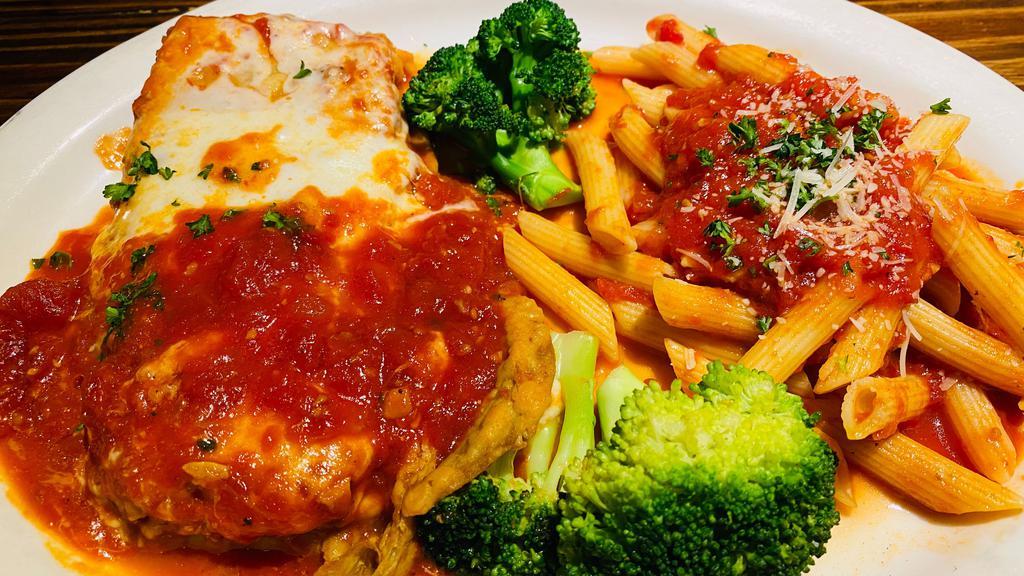 Eggplant Parmigiana · Sliced eggplant layered with marinara and pecorino baked with melted mozzarella served with a penne marinara and broccoli. Your choice of soup or salad and garlic bread.