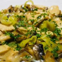 Chicken Scarpara · Tender chicken breast sauteed with garlic, mushrooms, and pepperoncini in lemon butter and w...