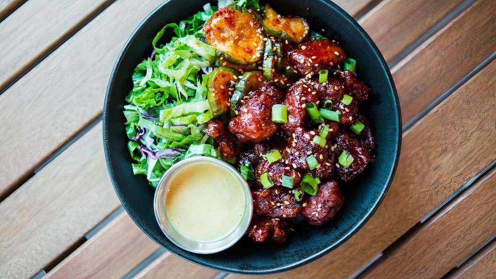 Korean Fried Chicken Bowl (Kfc) · Boneless Korean gochujang or sweet garlic fried chicken over your choice of rice, spicy pickles, lettuce cabbage mix and creamy sesame sauce.