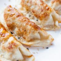 Potstickers · Six pieces of fried pork & vegetable potstickers with house dipping sauce