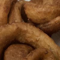 Onion Rings · Our thick-cut onion rings are made from whole white onions that are lightly beer-battered an...