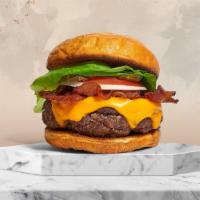 Bacon News Burger · American beef patty topped with melted cheese, multiple layers of crispy bacon, buttered let...