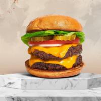 Nothing But Double Burger · Two American beef patties topped with melted cheese, buttered lettuce, tomato, onion, and pi...