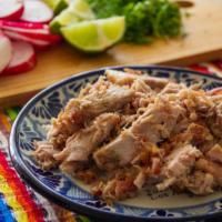 Pork Carnitas Plate · Slow cooked roast pork served with rice and beans with warm tortillas.