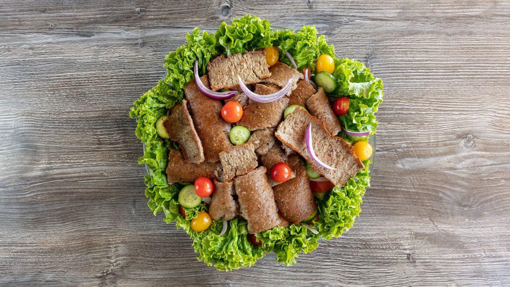 Gyro Salad · Lettuce, cucumber, olives, tomatoes, onions topped with thinly sliced gyro meat.