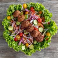Falafel Salad · Lettuce, olives, tomatoes, cucumber, onions topped with six pieces falafel served with tahin...