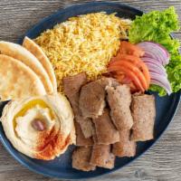 Gyro Platter · Thinly sliced beef and lamb served with rice or fries, salad and hummus.