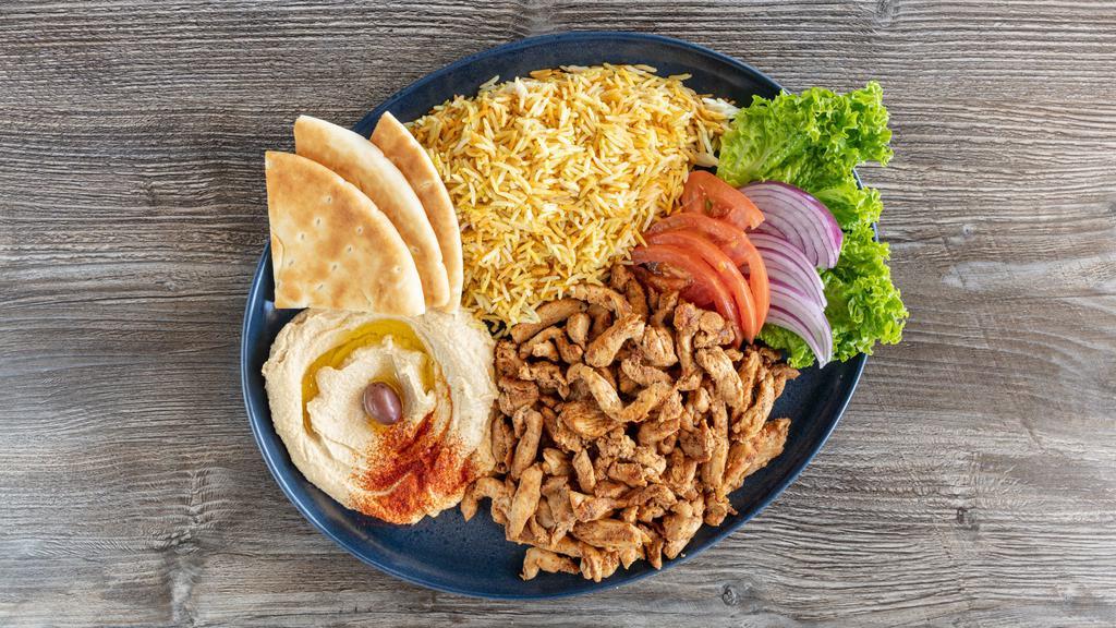 Chicken Shawarma Platter · Marinated and grilled chicken Shawarma served with rice or fries, salad and hummus.