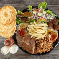 Family Platter · Serves 3 people. 
Falafel, gyro, chicken shawarma, hummus, baba ganoush, dolmades, rice or f...