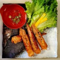 Traditional Vietnamese Eggrolls · Pork with taro, carrots, vermicelli noodles, mushrooms, and onions. Wrapped in egg-dough the...