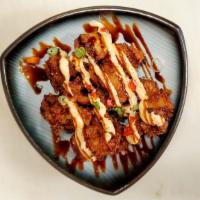 Chicken Karaage · Japanese fried chicken drizzled with spicy mayo and teriyaki. Sprinkled with togarashi, gree...