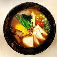 Vegan Ramen · Seared garlic miso broth served with fried tofu slices, shiitake mushroom, sweet choy, bambo...
