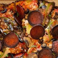 Cast Iron Vegan Super Pie · Follow Your Heart vegan mozzarella, house made cashew ricotta, black olive, bell pepper, red...