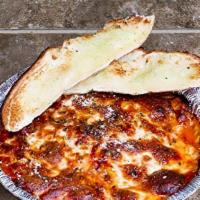 Mammas Lasagna · Meat lasagne covered with mead sauce topped with mozzarella baked. Includes piece of garlic ...