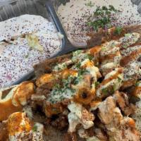 Lamb Plate · Lamb rice salad hummus taziki garlic sauce hot sauce