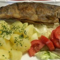 Trout · Pan-fried whole trout served with boiled potatoes, lemon, and salad.