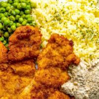 Wiener Schnitzel · Breaded veal or chicken breast hand-cut thin slices sprinkled with traditional herb seasonin...