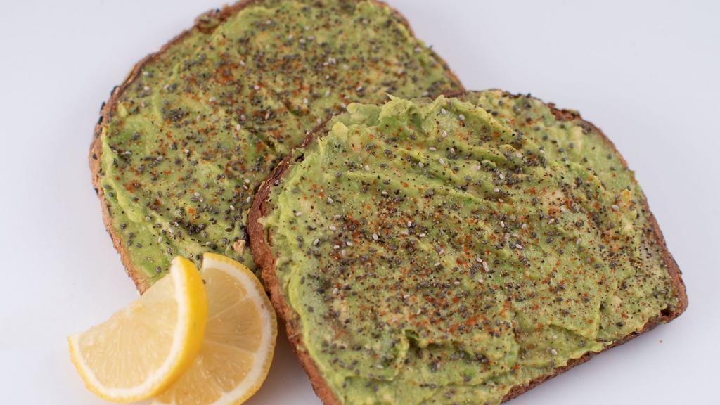 Avocado Toast · Organic Whole-Grain toast (2 slices) topped with avocado, chia seed, light cayenne, spices and lemon...
