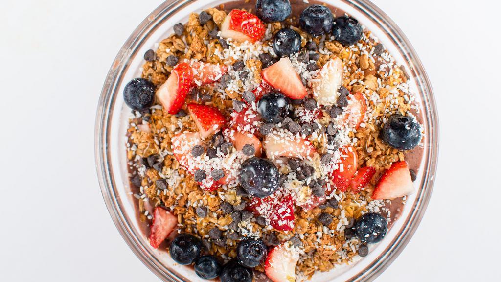 Sweet Tooth Acai · Chocolate PB (Peanut Butter) blend of acai, banana, cocoa powder, peanut butter and almond milk blended - topped with granola, chocolate chips, strawberry, blueberry, coconut flake & your choice of honey or agave.