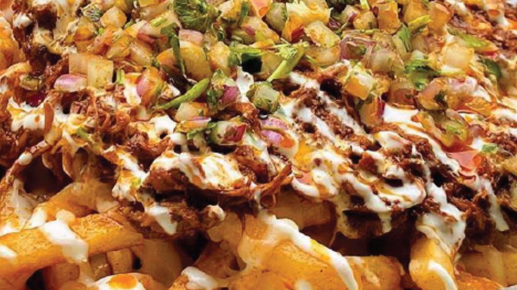 Loaded Birria Fries · Loaded Fried French fries tossed in our homemade seasoning and topped with your choice of delicious meat

Made with: onion, cilantro, tomato, lettuce, nacho cheese, shredded cheese, meat
