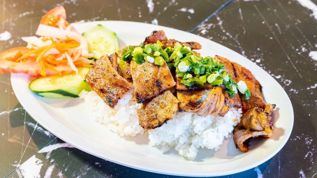 Cơm Tấm Heo (Pork) · Broken Rice with Grilled Pork, Lettuce, Tomatoes, Cucumbers, and side of Fish sauce. Broken Rice.