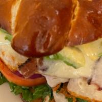 Pretzel Turkey Sandwich · Roasted turkey, bacon, avocado, jack cheese, lettuce, tomato, onion, honey mustard on pretze...