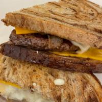 Patty Melt · Angus beef patty, American and Swiss cheese, caramelized onions, garlic aioli, on grilled ma...