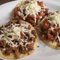 Vampiros  · Krispy regular tortilla with a base of cheese and topped with carne asada and more cheese on...