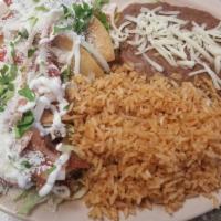Carnitas Plate · 1/2 Pound of Carnitas mix with rice & beans, cheese, red & green sauce, onions & cilantro. l...