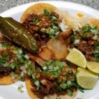3 Tacos Of Birria (Street Tacos) Rice & Beans · 3  Street Tacos of beef (birria style)
onion & cilantro, limes, red & green sauce.
rice & be...