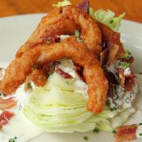 Classic Wedge Salad · Iceberg wedge topped with bacon bits, fried onions and choice of house-made dressing.