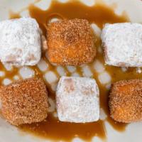 Biscuit Beignets · Biscuit dough deep fried. Choice of cinnamon sugar , powdered sugar. or half n half!