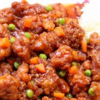 General Tao'S Chicken · Fried chicken sautéed in a sweet and spicy sauce with peas and carrots.